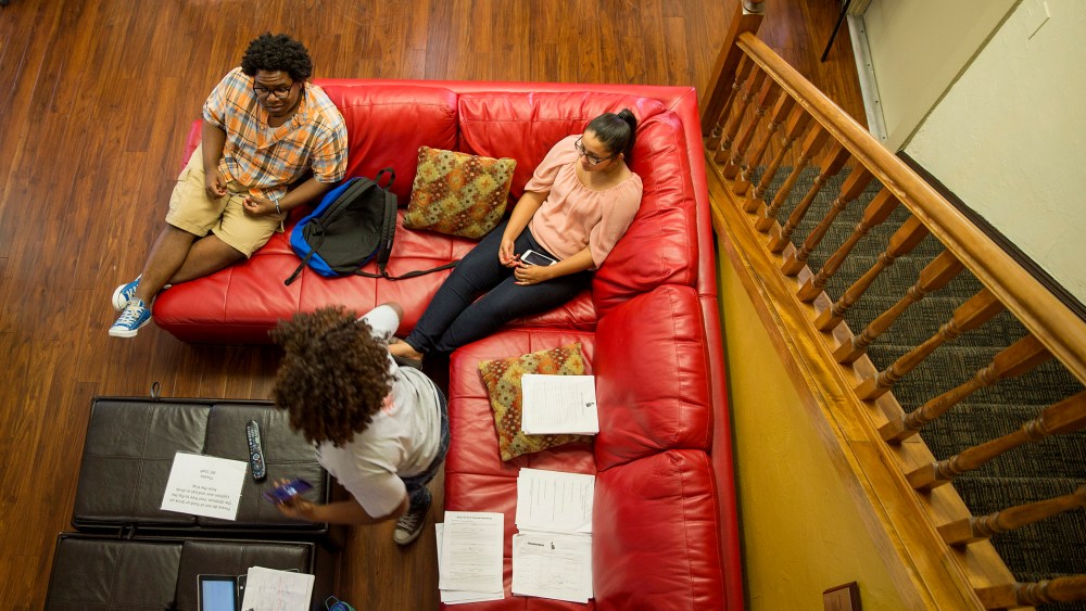 Dashari Kearse, 20, (Left) Maria Neris, 20, (Right) and Susan Ajayi, 21, (Foreground) talk inside the Institute of Black Culture Center in Gainesville, Fla. (Photo by Willie J. Allen Jr./Getty)