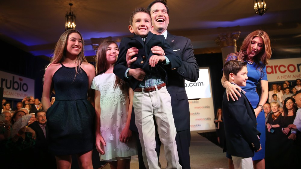 U.S. Sen. Marco Rubio (R-FL) holds his son, Anthony Rubio, as he stands with his family after he announced his candidacy for the Republican presidential nomination during an event at the Freedom Tower, April 13, 2015 in Miami. (Photo by Joe Raedle/Getty)
