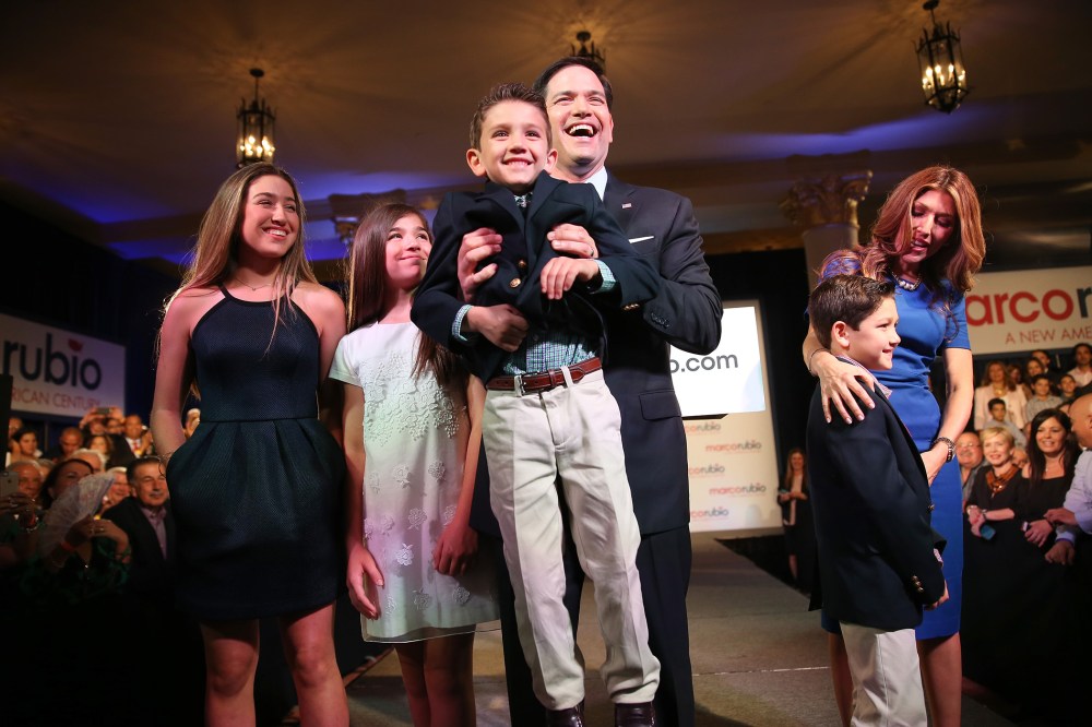 U.S. Sen. Marco Rubio (R-FL) holds his son, Anthony Rubio, as he stands with his family after he announced his candidacy for the Republican presidential nomination during an event at the Freedom Tower, April 13, 2015 in Miami. (Photo by Joe Raedle/Getty)