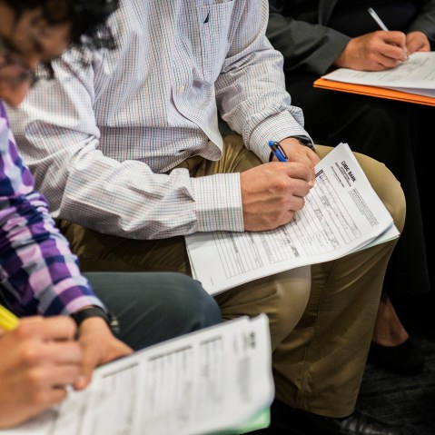 Job seekers fill out applications at the Choice Career Fair in San Antonio, Texas, on April 16, 2015. (Photo by Matthew Busch/Bloomberg/Getty)