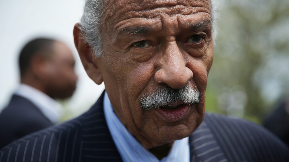 U.S. Rep. John Conyers (D-MI) speaks to a reporter at the end of a news conference April 22, 2015 on Capitol Hill in Washington, DC. Rep. Conyers held the news conference to discuss the "End Racial Profiling Act." (Photo by Alex Wong/Getty)