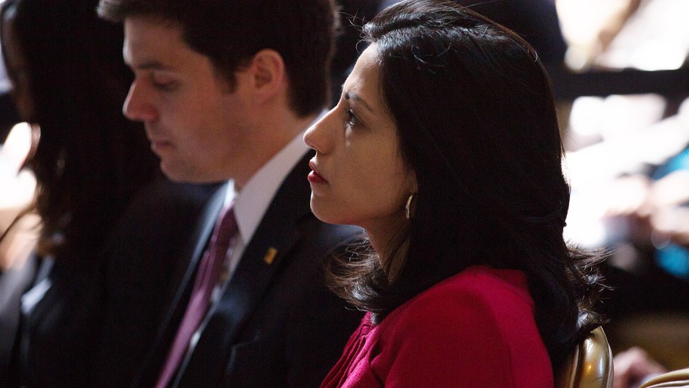 Clinton aide Huma Abedin watches as Secretary of State Hillary Clinton speaks at Columbia University April 29, 2015 in New York City. (Photo by Kevin Hagen/Getty)
