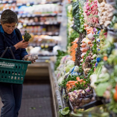 A customer shops for produce at a Whole Foods Market Inc. store in Oakland, Calif. on May 6, 2015.