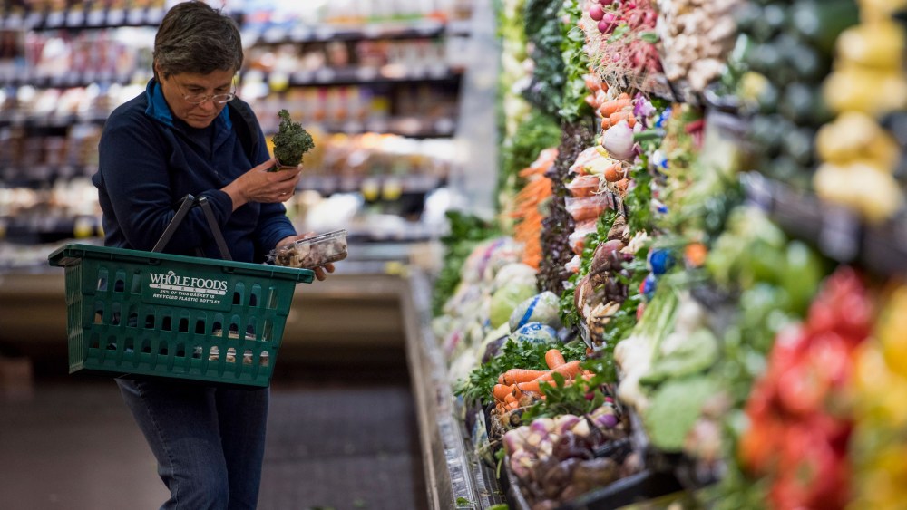 A customer shops for produce at a Whole Foods Market Inc. store in Oakland, Calif. on May 6, 2015.