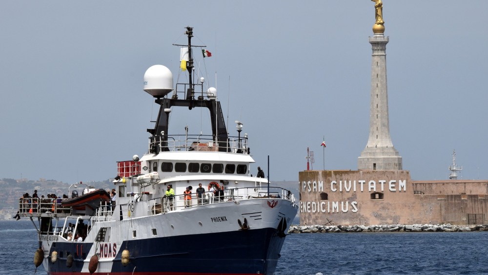 The Migrant Offshore Aid Station vessel arrives in the port of Messina, on May 16, 2015 following rescue operations of migrants at sea off the coast of Sicily in partnership with NGO Doctors Without Borders. (Photo by Giovanni Isolino/AFP/Getty)