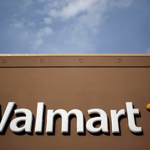Wal-Mart Stores Inc. signage is displayed outside of a store in Louisville, Ky., May 15, 2015. (Photo by Luke Sharrett/Bloomberg/Getty)