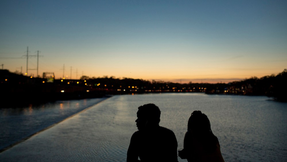The silhouettes of people are seen watching the sunset over the Schuylkill River in Philadelphia, May 8, 2015. Philadelphia. (Photo by Victor J. Blue/Bloomberg/Getty)