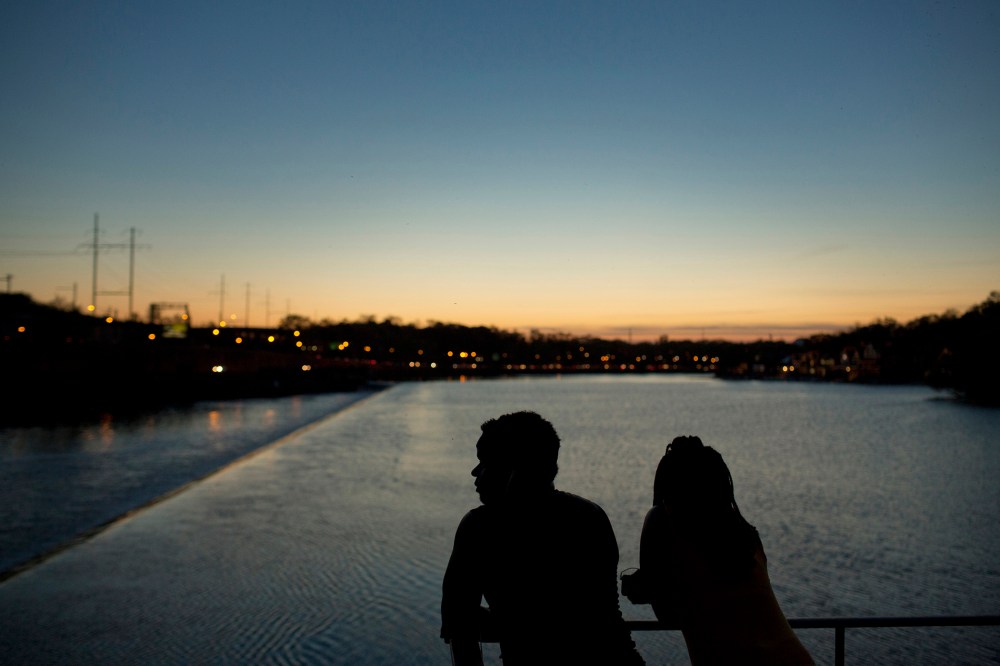 The silhouettes of people are seen watching the sunset over the Schuylkill River in Philadelphia, May 8, 2015. Philadelphia. (Photo by Victor J. Blue/Bloomberg/Getty)