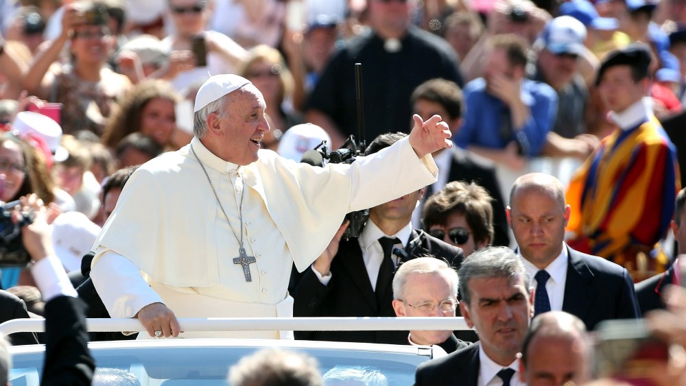 Pope Francis waves to the faithful as he arrives in St. Peter's square for his weekly audience on June 3, 2015 in Vatican City, Vatican. (Photo by Franco Origlia/Getty)