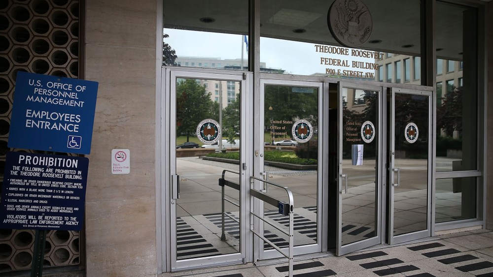 The entrance to the Theodore Roosevelt Federal Building that houses the Office of Personnel Management headquarters is shown June 5, 2015 in Washington, D.C. (Photo by Mark Wilson/Getty)