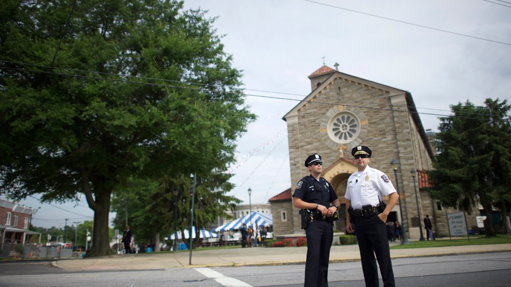 Police officers monitor activity outside St. Anthony of Padua Church before the burial is held for former Delaware Attorney General Beau Biden on June 6, 2015 in Wilmington, Del. (Photo by Mark Makela/Getty)
