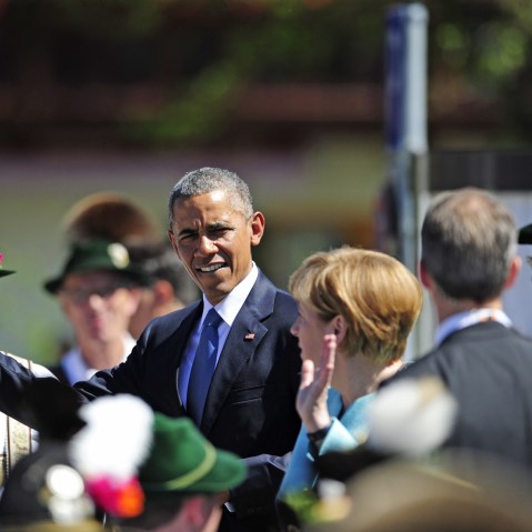 US President Barack Obama waves to guests upon arrival at a meeting with German Chancellor Angela Merkel in Kruen near Garmisch-Partenkirchen on June 7, 2015 before the start of a G7 summit. (Photo by Robert Michael/AFP/Getty)