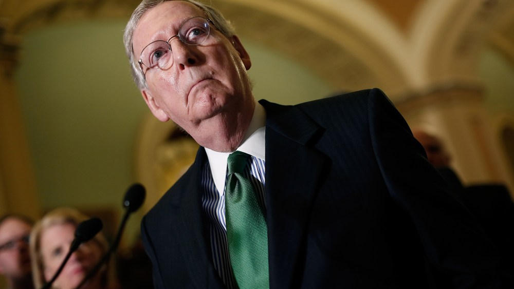 Senate Majority Leader Mitch McConnell answers questions as members of the Republican leadership speak about the Defense Authorization Bill following caucus luncheons at the U.S. Capitol on June 9, 2015 in Washington, DC. (Photo by Win McNamee/Getty)