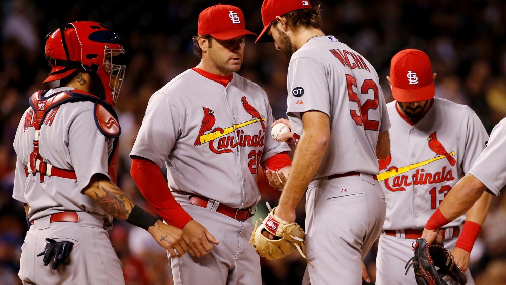 Manager Mike Matheny of the St. Louis Cardinals removes starting pitcher Michael Wacha from the game against the Colorado Rockies in the seventh inning, June 9, 2015 in Denver, Colo. (Photo by Doug Pensinger/Getty)