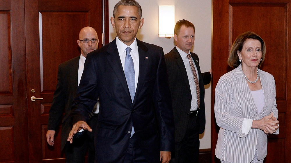 U.S. President Barack Obama and House Minority Leader Nancy Pelosi leave the Gabriel Zimmerman room on Capitol Hill, June 12, 2015 in Washington, D.C. (Photo by Olivier Douliery-Pool/Getty)