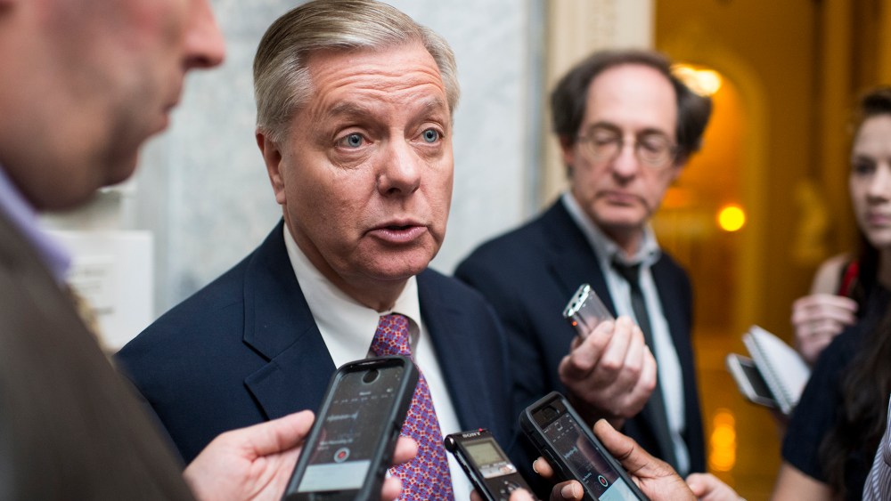 Sen. Lindsey Graham speaks with reporters as he leaves the Senate Republicans' policy lunch on June 16, 2015. (Photo by Bill Clark/CQ Roll Call/Getty)