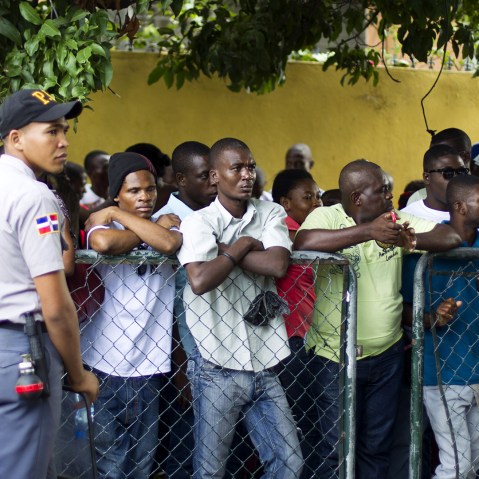 Haitians queue up to legalize their status at the Interior Ministry in Santo Domingo, on June 16, 2015. (Photo by Erika Santelices/AFP/Getty)