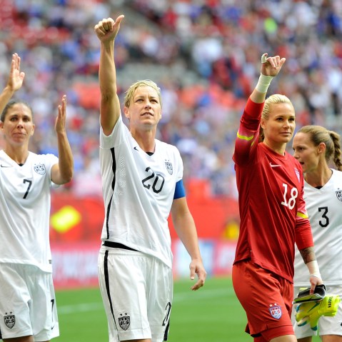 Shannon Boxx #7, Abby Wambach #20, Ashlyn Harris #18, and Christie Rampone #3 of the United States celebrate with teammates on June 16, 2015 in Vancouver, Canada. (Photo by Rich Lam/Getty)