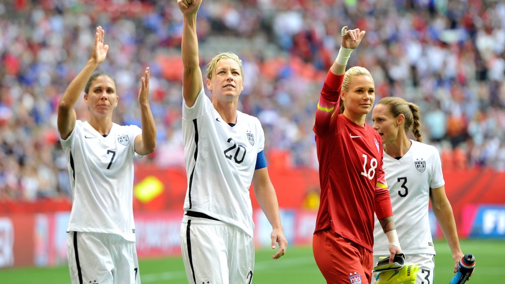 Shannon Boxx #7, Abby Wambach #20, Ashlyn Harris #18, and Christie Rampone #3 of the United States celebrate with teammates on June 16, 2015 in Vancouver, Canada. (Photo by Rich Lam/Getty)
