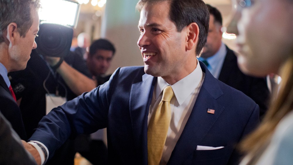 Sen. Marco Rubio walks past Sen. Rand Paul during the Faith & Freedom Coalitions Road to Majority conference which featured speeches by conservative politicians at the Omni Shoreham Hotel, June 18, 2015. (Photo By Tom Williams/CQ Roll Call/Getty)