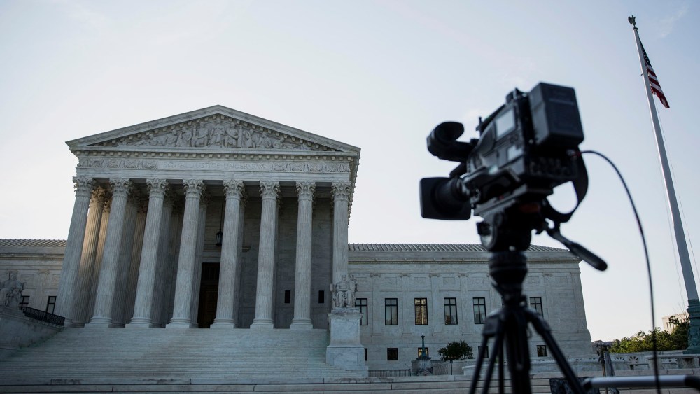 A camera sits on a tripod in front of the U.S. Supreme Court in Washington, D.C. (Drew Angerer/Bloomberg/Getty).