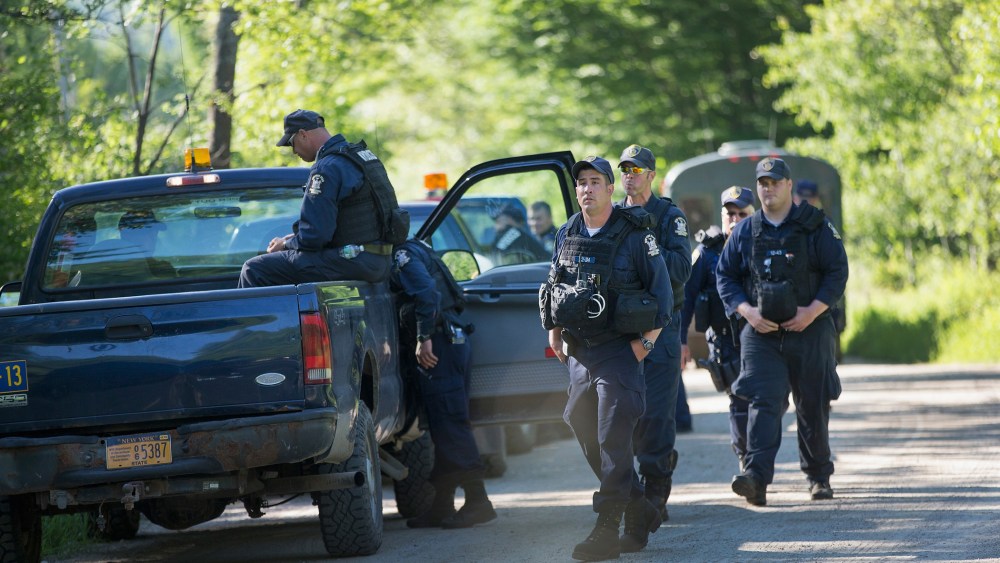 Law enforcement personnel prepare to head out on a search for convicted murderers Richard Matt and David Sweat on June 26, 2015 near Malone, N.Y. (Photo by Scott Olson/Getty)