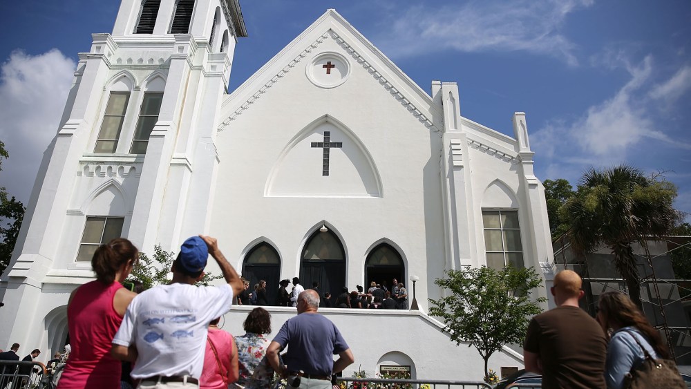 People look on as mourners file into the funeral of Cynthia Hurd, 54, at the Emanuel African Methodist Episcopal Church on June 27, 2015 in Charleston, S.C. (Photo by Joe Raedle/Getty)