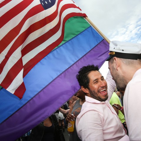 Francisco Pavon and his friend Brandon McCarthy celebrate in front of San Francisco's iconic Castro Theater during gay pride weekend on June 27, 2015 in San Francisco, Calif. (Photo by Elijah Nouvelage/Getty)