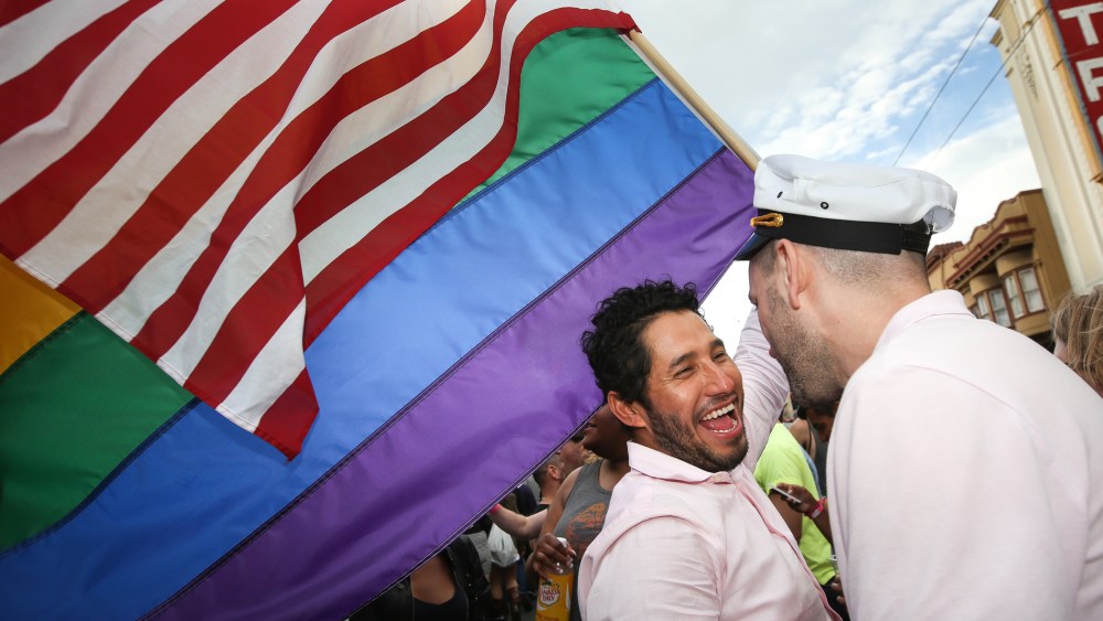 Francisco Pavon and his friend Brandon McCarthy celebrate in front of San Francisco's iconic Castro Theater during gay pride weekend on June 27, 2015 in San Francisco, Calif. (Photo by Elijah Nouvelage/Getty)