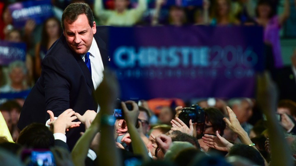 Chris Christie reaches out to greet a supporter after announcing that he will run for president at Livingston High School in Livingston, N.J., June 30, 2015. (Photo by Ron Antonelli/Bloomberg/Getty)