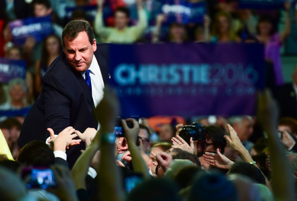 Chris Christie reaches out to greet a supporter after announcing that he will run for president at Livingston High School in Livingston, N.J., June 30, 2015. (Photo by Ron Antonelli/Bloomberg/Getty)