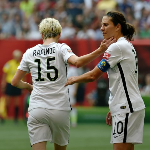 Carli Lloyd greets exiting teammate Megan Rapinoe during the FIFA Women's World Cup Final against Japan, which they won, at BC Place Stadium on July 5, 2015 in Vancouver, Canada. (Photo by Rich Lam/Getty)