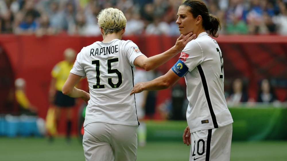 Carli Lloyd greets exiting teammate Megan Rapinoe during the FIFA Women's World Cup Final against Japan, which they won, at BC Place Stadium on July 5, 2015 in Vancouver, Canada. (Photo by Rich Lam/Getty)
