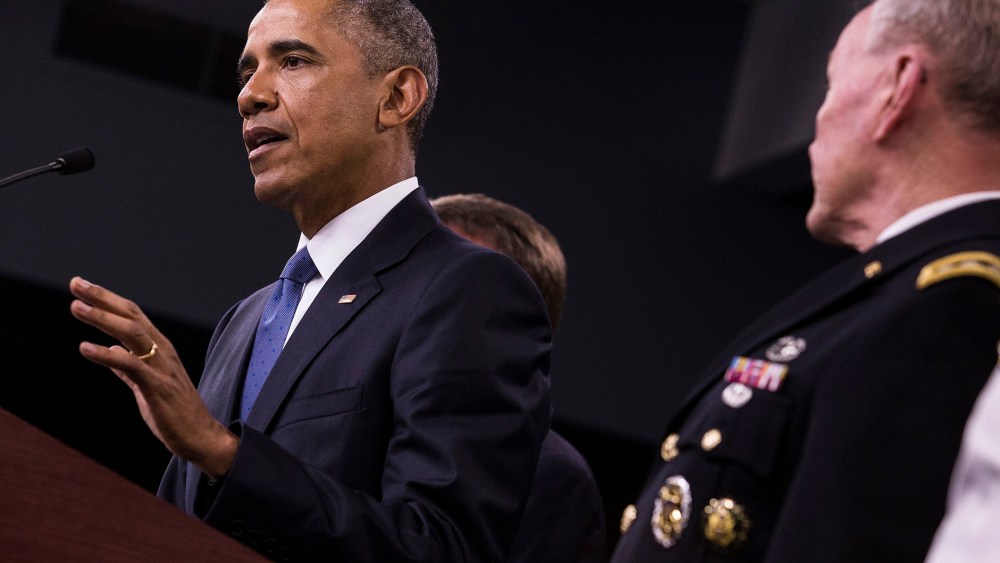 U.S. President Barack Obama, left, speaks during a news conference with General Martin Dempsey, chairman of the Joint Chiefs of Staff, at the Pentagon in Arlington, Va. on July 6, 2015. (Photo by Drew Angerer/Bloomberg/Getty)