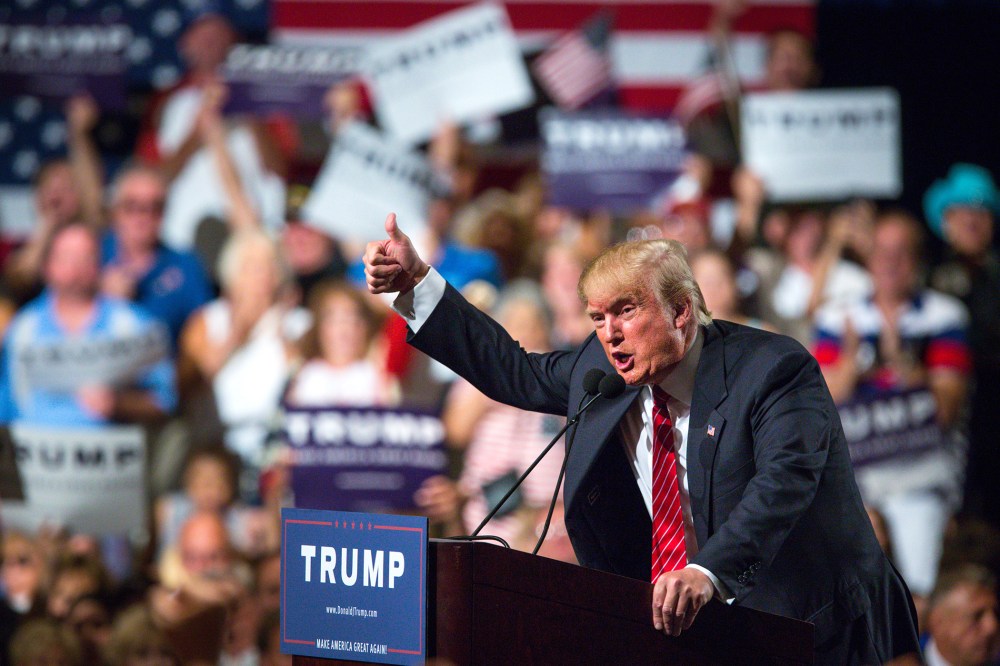 Republican Presidential candidate Donald Trump addresses supporters during a political rally at the Phoenix Convention Center on July 11, 2015 in Phoenix, Ariz. (Photo by Charlie Leight/Getty)