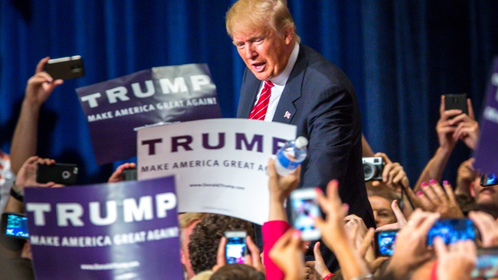Republican Presidential candidate Donald Trump addresses supporters during a political rally at the Phoenix Convention Center on July 11, 2015 in Phoenix, Ariz. (Photo by Charlie Leight/Getty)