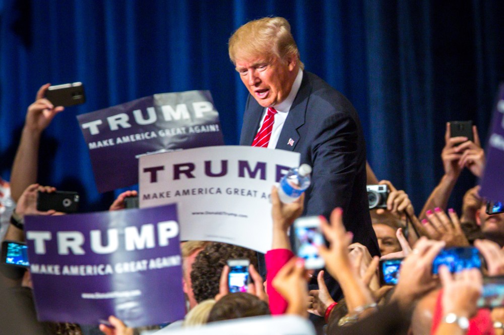 Republican Presidential candidate Donald Trump addresses supporters during a political rally at the Phoenix Convention Center on July 11, 2015 in Phoenix, Ariz. (Photo by Charlie Leight/Getty)