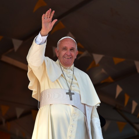 Pope Francis waves during a visit to the people of Banado Norte at the Chapel of Juan Bautista in Asuncion on July 12, 2015 (Photo by Vincenzo Pinto/AFP/Getty).