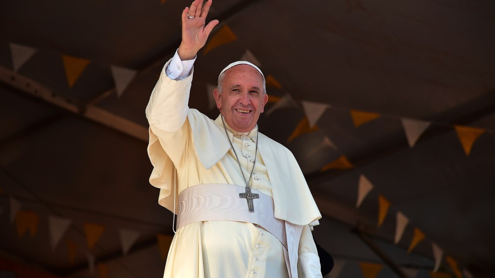 Pope Francis waves during a visit to the people of Banado Norte at the Chapel of Juan Bautista in Asuncion on July 12, 2015 (Photo by Vincenzo Pinto/AFP/Getty).
