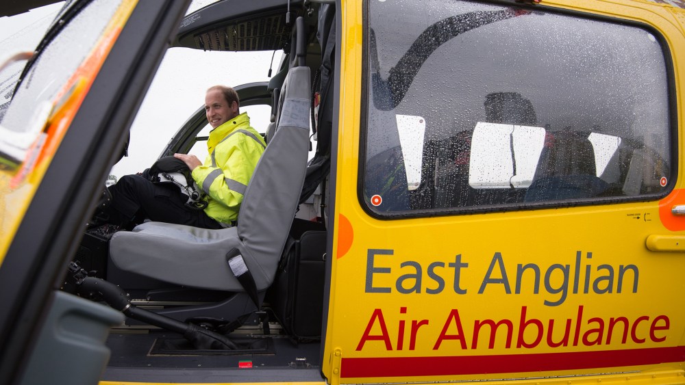 Prince William, The Duke of Cambridge sits in the cockpit of an helicopter as he begins his new job with the East Anglian Air Ambulance (EAAA) at Cambridge Airport on July 13, 2015 in Cambridge, England. (Photo by Stefan Rousseau/WPA/Pool/Getty)