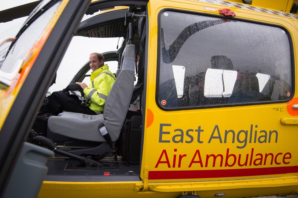 Prince William, The Duke of Cambridge sits in the cockpit of an helicopter as he begins his new job with the East Anglian Air Ambulance (EAAA) at Cambridge Airport on July 13, 2015 in Cambridge, England. (Photo by Stefan Rousseau/WPA/Pool/Getty)