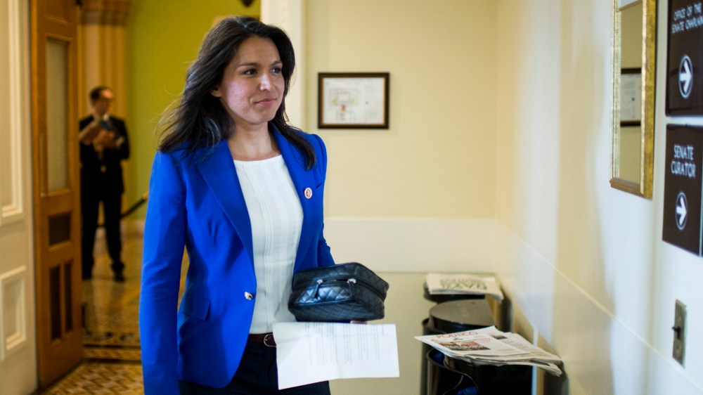Rep. Tulsi Gabbard, D-Hawaii, arrives to participate in the news conference on March 26, 2014, in Washington, D.C. (Photo By Bill Clark/CQ Roll Call/Getty)