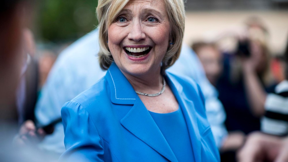 Secretary Hillary Clinton greets voters at a house party in Windham, N.H. (Photo by Melina Mara/The Washington Post/Getty).