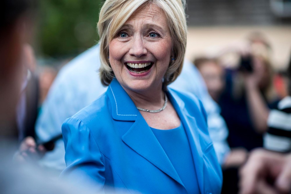 Secretary Hillary Clinton greets voters at a house party in Windham, N.H. (Photo by Melina Mara/The Washington Post/Getty).