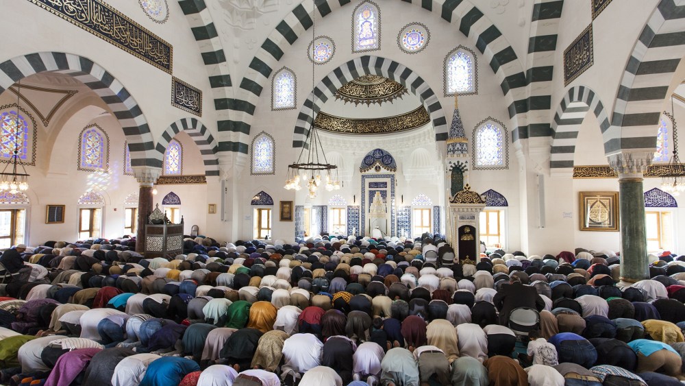Thousands of Muslims gather at the Turkish American Cultural Center Mosque to observe Eid al-Fitr during the holy month of Ramadan in Lanham, Md., July 17, 2015. (Photo by Samuel Corum/Anadolu Agency/Getty)