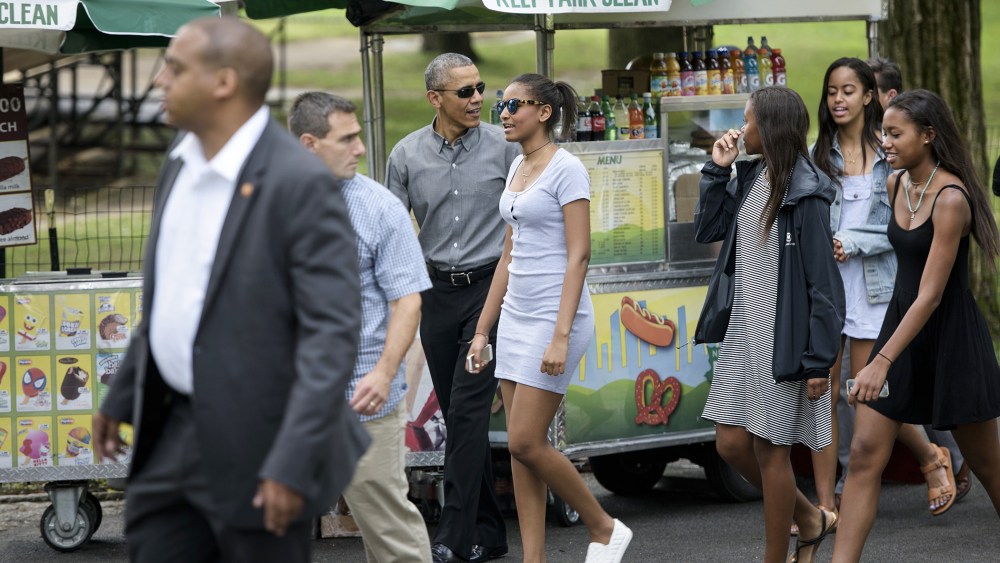 US President Barack Obama walks with daughters Sasha Obama (C) and Malia Obama (2R) and others in Central Park on July 18, 2015 in New York, N.Y. (Photo by Brendan Smialowski/AFP/Getty)