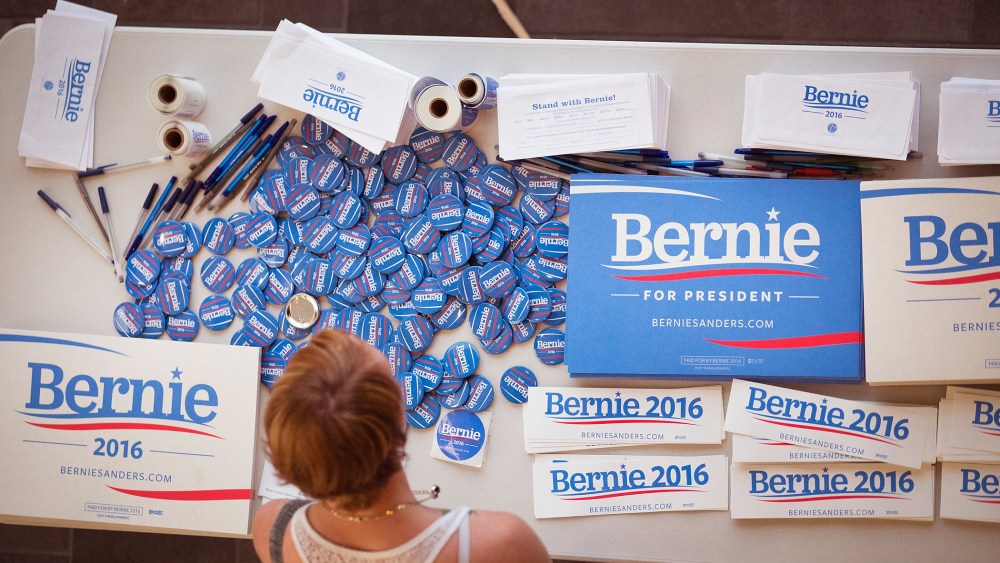 A supporter of Democratic presidential candidate Senator Bernie Sanders (I-VT) looks over campaign materials at a town hall meeting hosted by the candidate at Valley High School on July 24, 2015 in West Des Moines, Iowa. (Photo by Scott Olson/Getty)