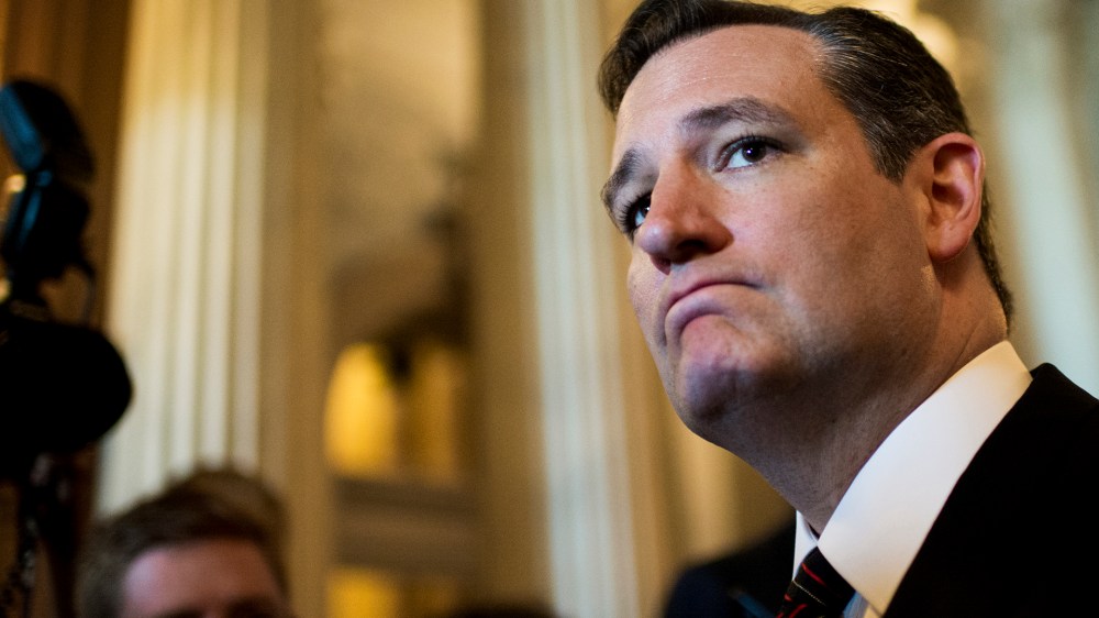 Sen. Ted Cruz speaks with reporters as he emerges from the Senate chamber on July 26, 2015. (Photo by Bill Clark/CQ Roll Call/Getty)