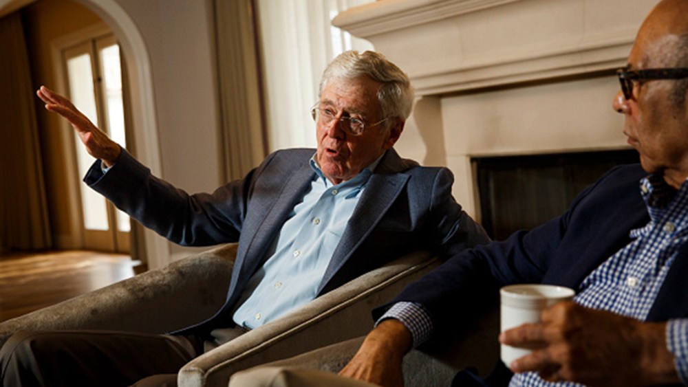 Charles Koch and Dr. Michael Lomax, president and CEO of the United Negro College Fund, speak with the Washington Post at the Freedom Partners Summit on Aug. 3, 2015 in Dana Point, Ca. (Photo by Patrick T. Fallon/The Washington Post/Getty)