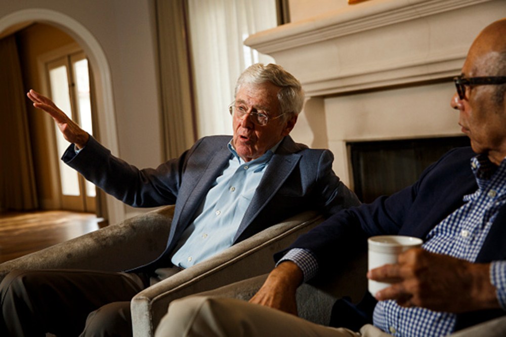 Charles Koch and Dr. Michael Lomax, president and CEO of the United Negro College Fund, speak with the Washington Post at the Freedom Partners Summit on Aug. 3, 2015 in Dana Point, Ca. (Photo by Patrick T. Fallon/The Washington Post/Getty)